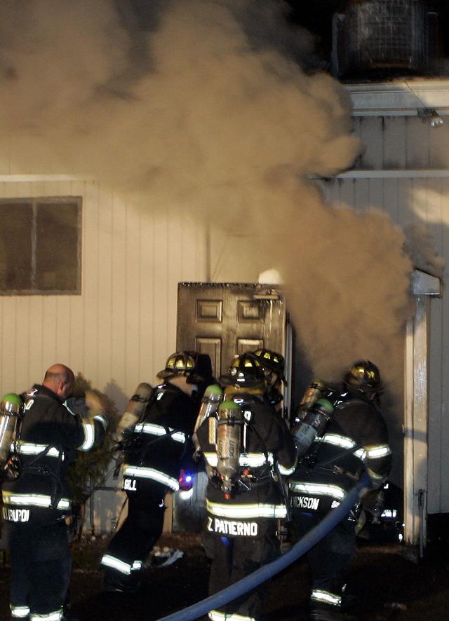 Mutual aid Katonah Old Deer Park Fire. BHFD members gaining access to the basement.